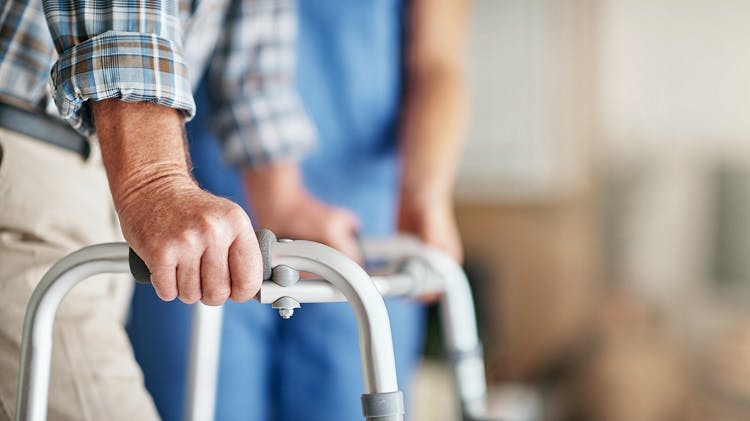 survivor using a wheelchair, a type of adaptive equipment for stroke patients