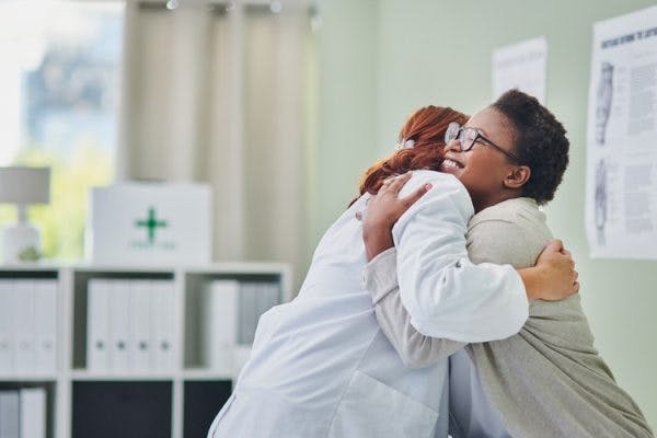 doctor and stroke patient hugging