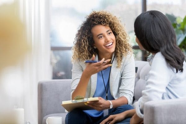 patient with anomic aphasia practicing speech therapy exercises with therapist