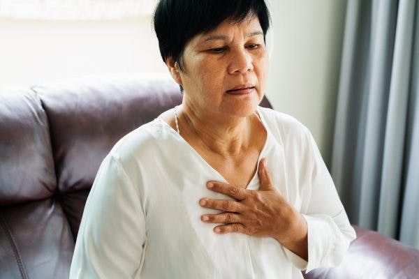 Older woman feeling the effects of autonomic dysfunction after concussion