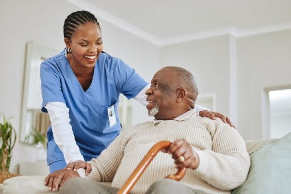 home nurse talking to patient with dizziness after stroke