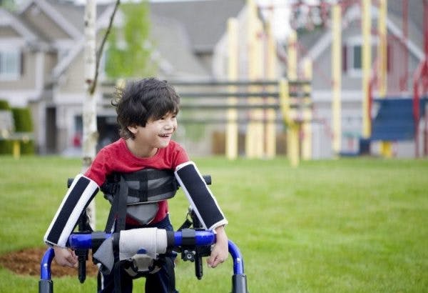 child with cerebral plasy using adaptive equipment to become more independent