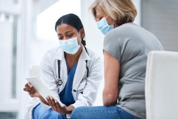 doctor discusses fatigue with adult with cerebral palsy