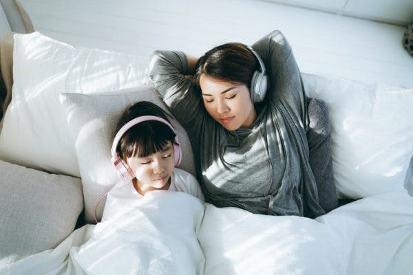 mother and daughter meditating to music to help cerebral palsy behavior problems