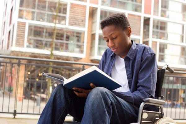 teen reading about the cognitive effects of spinal cord injury