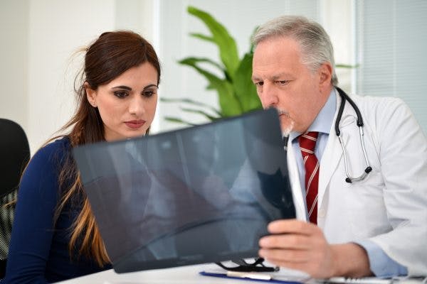 doctor explaining heterotopic ossification to spinal cord injury patient
