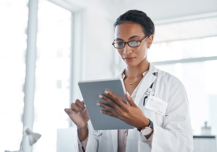 female doctor looking at tablet to assess the stroke prognosis and provide estimated recovery outlook