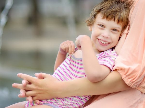 young girl with dyskinetic cerebral palsy smiling