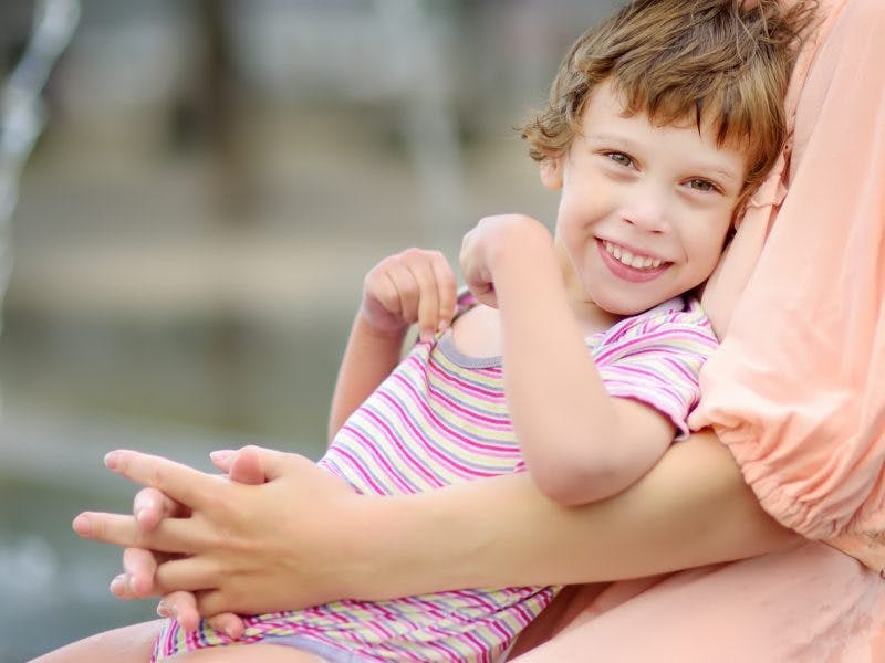 young girl with dyskinetic cerebral palsy smiling