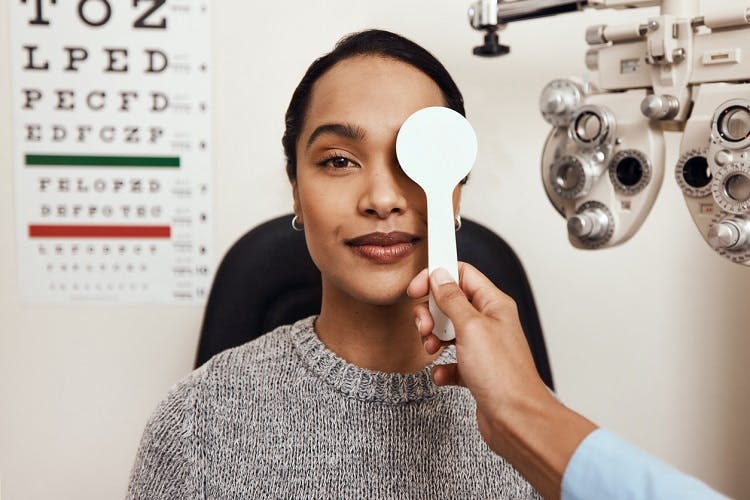 doctor helps survivor with regaining eyesight after stroke by testing her vision