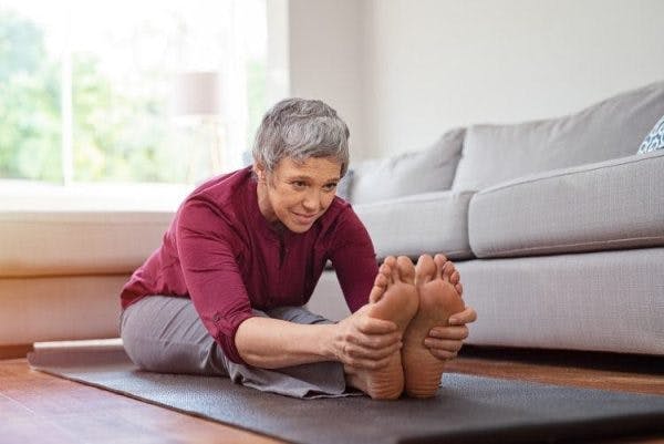 survivor practicing exercises to help her foot drop after tbi