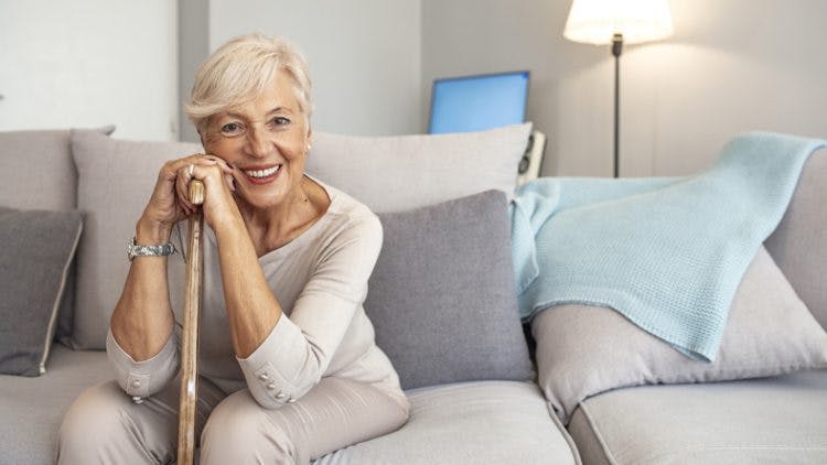 stroke patient holding cane before gait training exercises