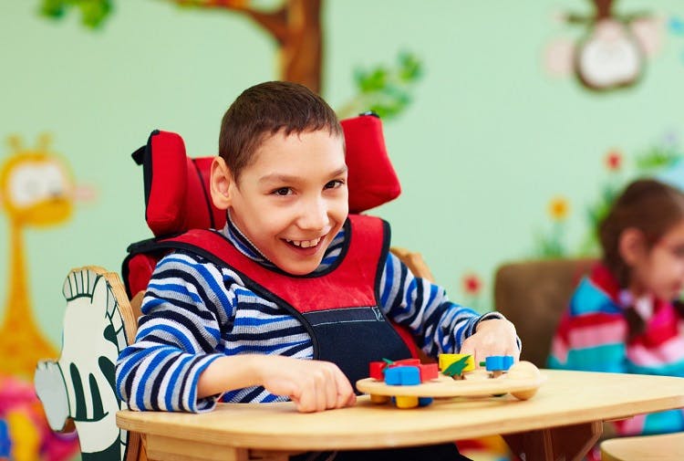 young boy with hydrocephalus and cerebral palsy