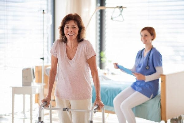 nurse helping woman with brain injury manage bladder and bowel incontinence