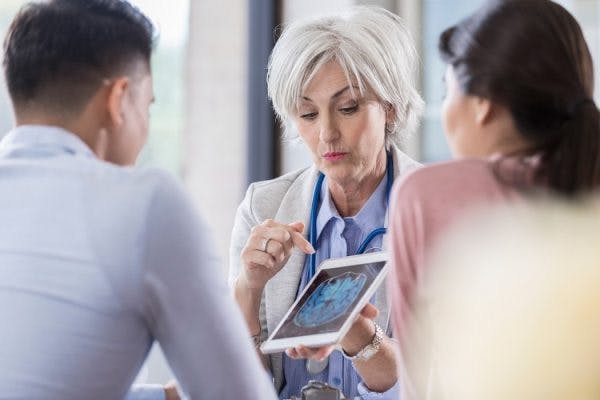 doctor educating her patients about inflammation and stroke