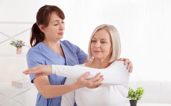 Doctor and patient in rehabilitation clinic after getting intrathecal baclofen pump to manage spasticity