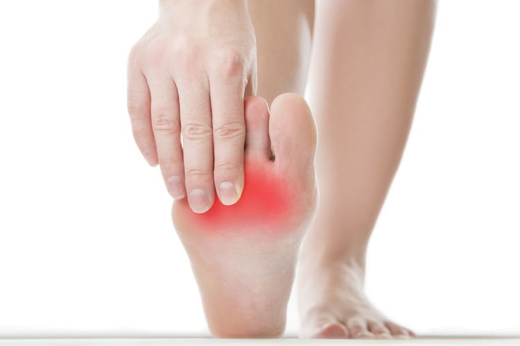 foot with crooked toes illustrated with red highlighting