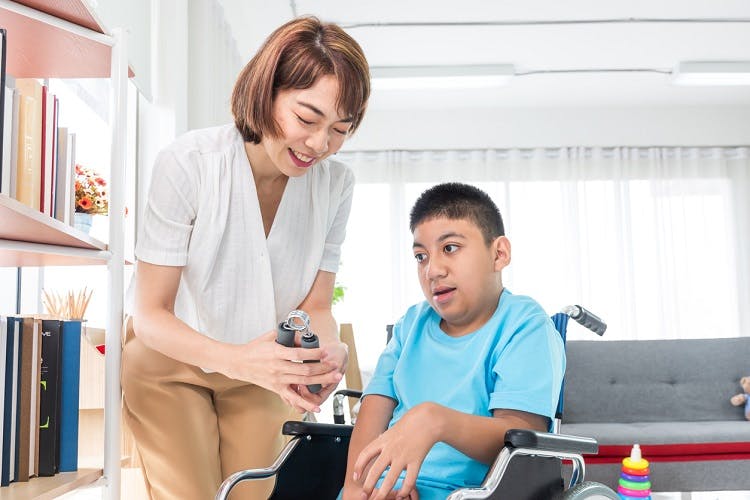 child with cerebral palsy experiencing motor impairments in hands