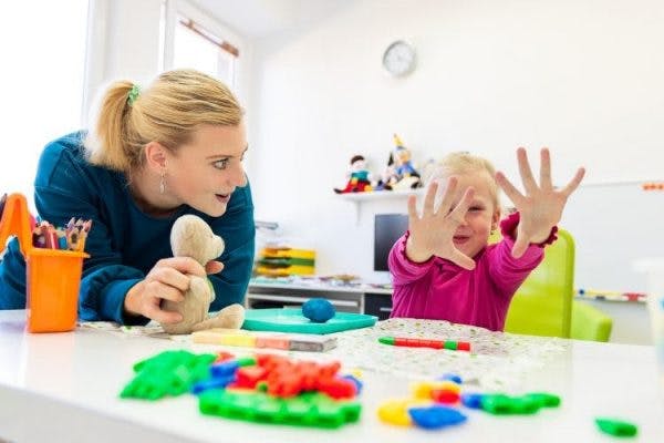 young child with cerebral palsy practicing occupational therapy activities