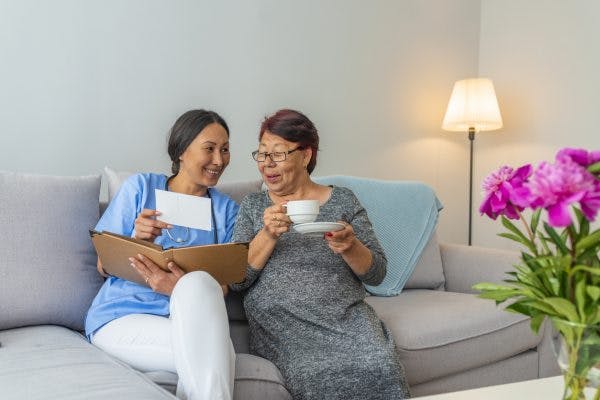 occupational therapist recommending tools to stroke patient