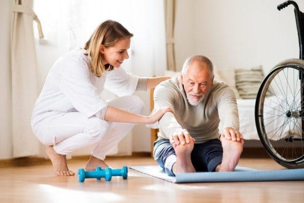 man practicing paraplegic exercises to strengthen and stretch his legs