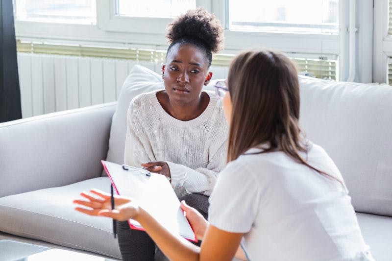 stroke patient talking with therapist about pseudobulbar affect treatment