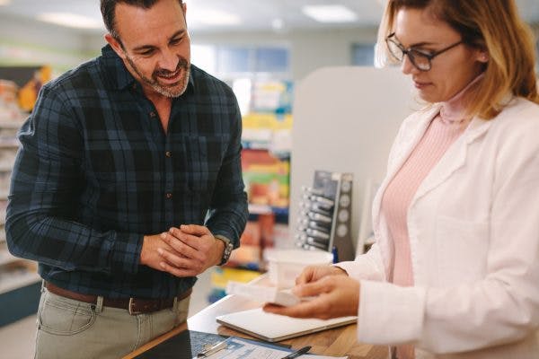 Pharmacist giving advice about Ritalin for brain injury to customer