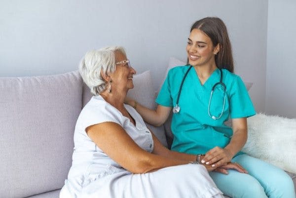 occupational therapist working with patient on sensory reeducation after stroke