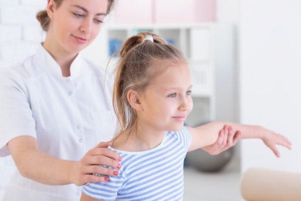 young girls with a type of cerebral palsy called spastic hemiplegia participating in physical therapy exercises