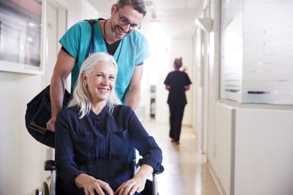 nurse explaining spinal cord injury recovery statistics to help patient understand that recovery is possible