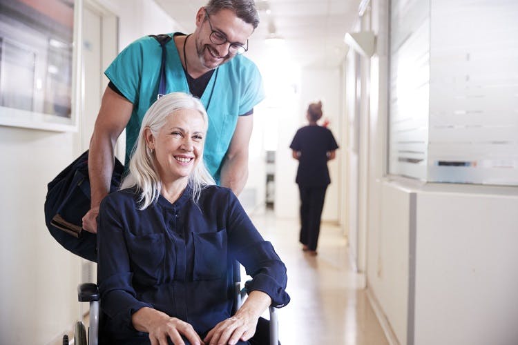 nurse explaining spinal cord injury recovery statistics to help patient understand that recovery is possible