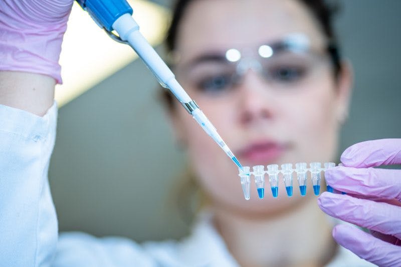 Scientist performing stem cell therapy research for brain injury treatment