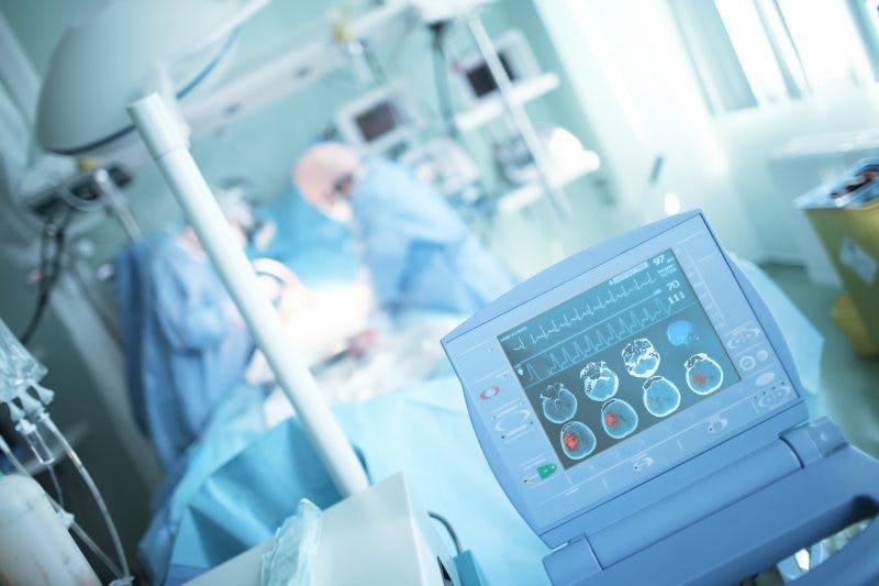 neurosurgeon performing operation on hemorrhagic stroke patient
