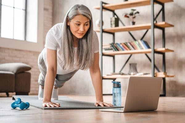 woman engaging in traumatic brain injury recovery exercises at home