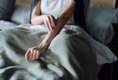 survivor experiencing tingling and numbness after spinal cord injury in the arm
