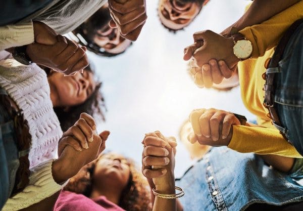 a group of survivors holding hands to help with adynamia and lack of motivation after brain injury