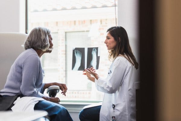 doctor sharing with patient tips on how to fix foot drop after a neurological injury