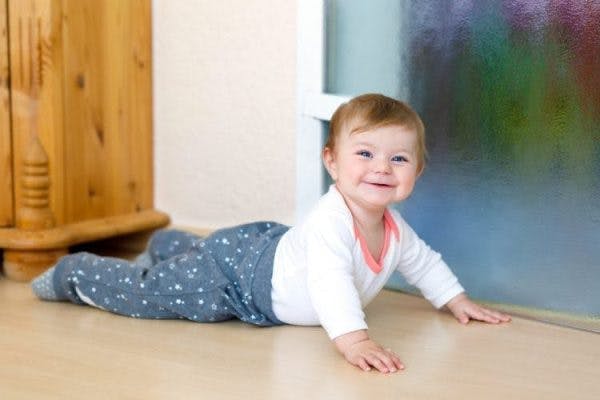 child with cerebral palsy commando crawling