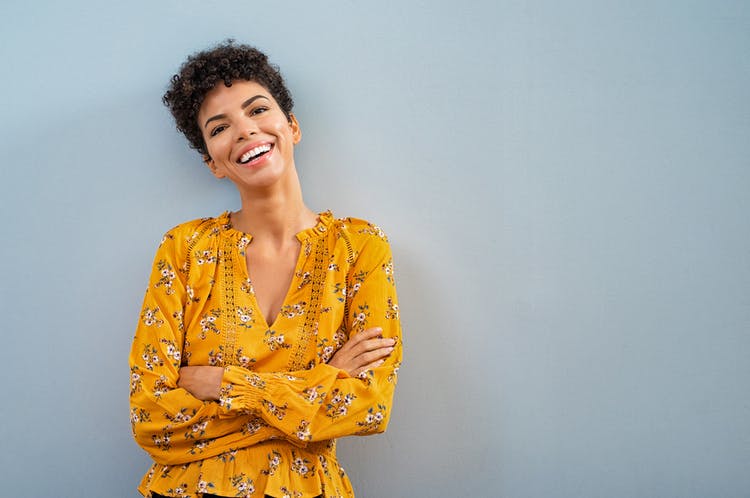 woman with fluent aphasia smiling and looking normal, which many fluent aphasia patients do
