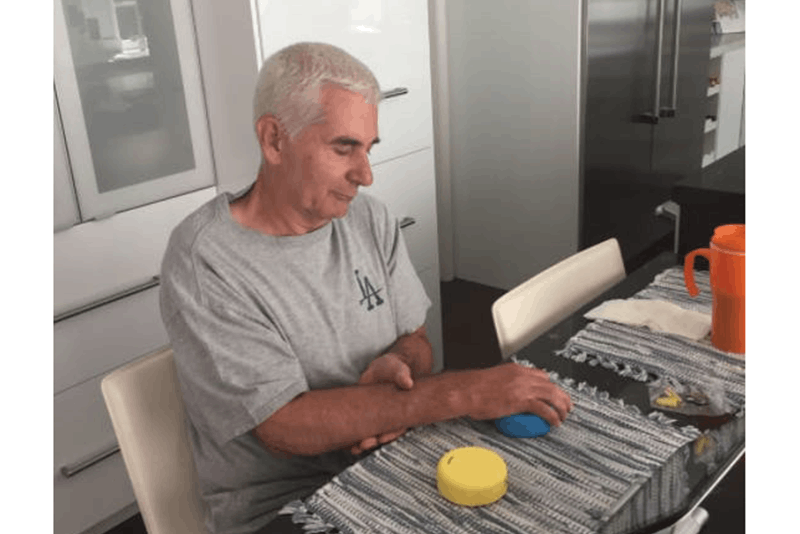 stroke survivor using the fitmi for home rehab